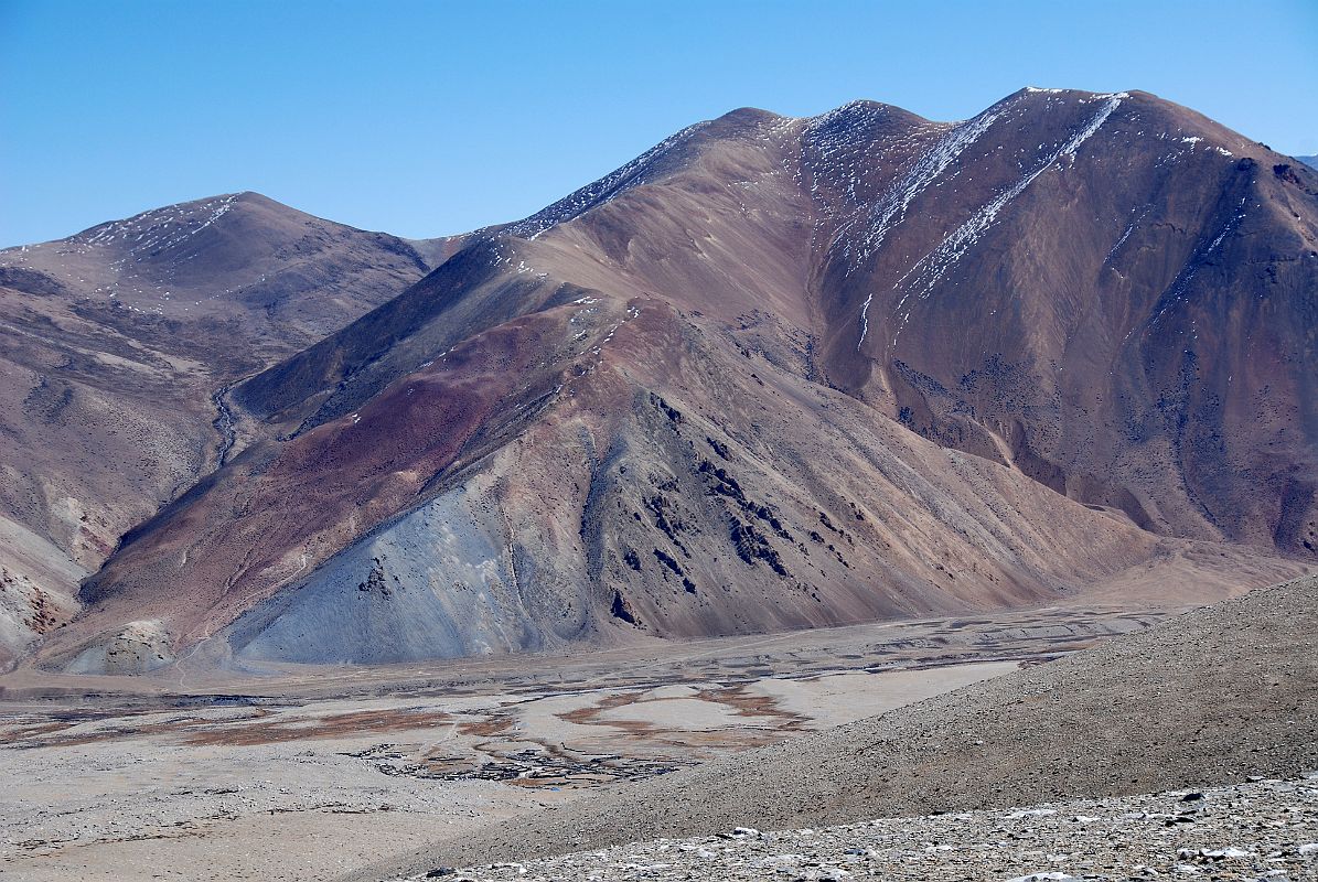 35 First View Of Ngora On Trail From Kong Tso Ngora (4463m) is nestled below colourful hills on the trek from Kong Tso.